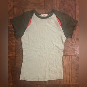 Retro Knot brand baby tee shirt. Sage w zippers by arms that unzip orange color